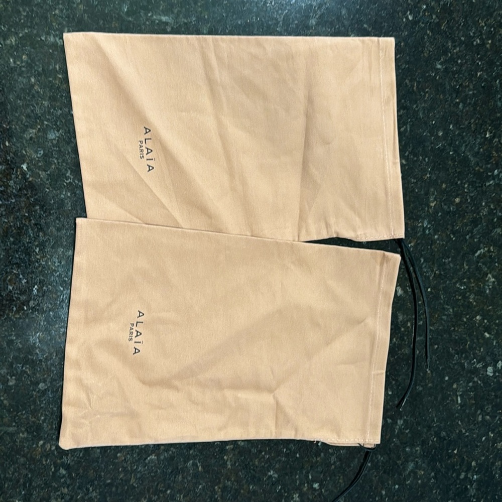 Pair of Alaia dust bags, brand new.           Each measures 8 x 14.